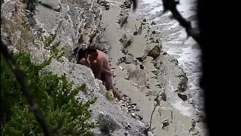 play Couple having sex on rocky beach on hidden voyeur cam.